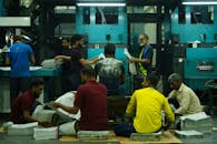 Men Working in a Newspaper Printing Factory