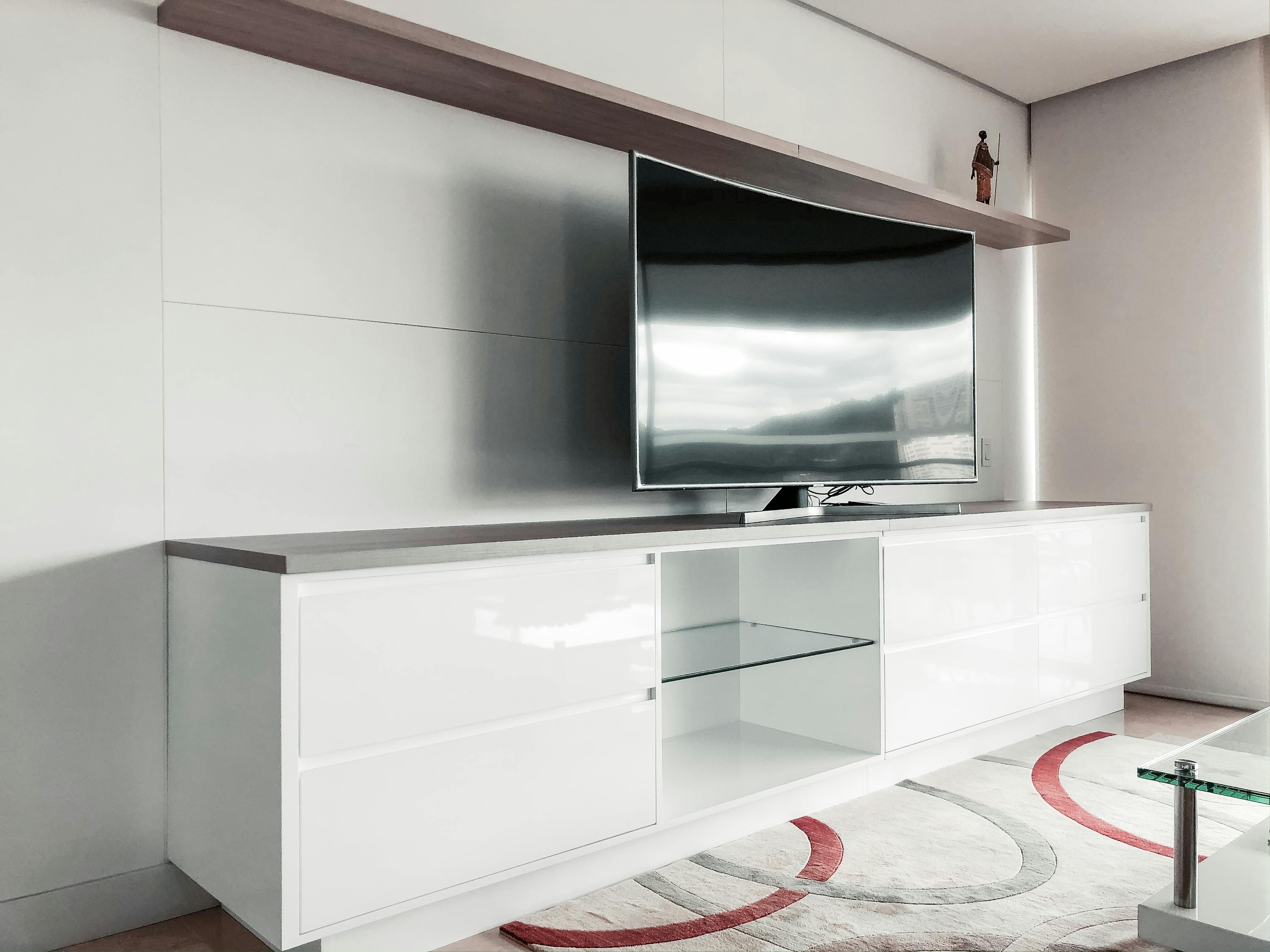 Black Flat Screen Tv on White Wooden Tv Rack