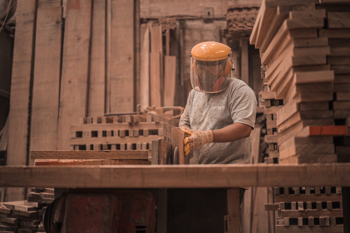 Man In Grey Crew Neck T-Shirt Wearing Yellow Hard Helmet