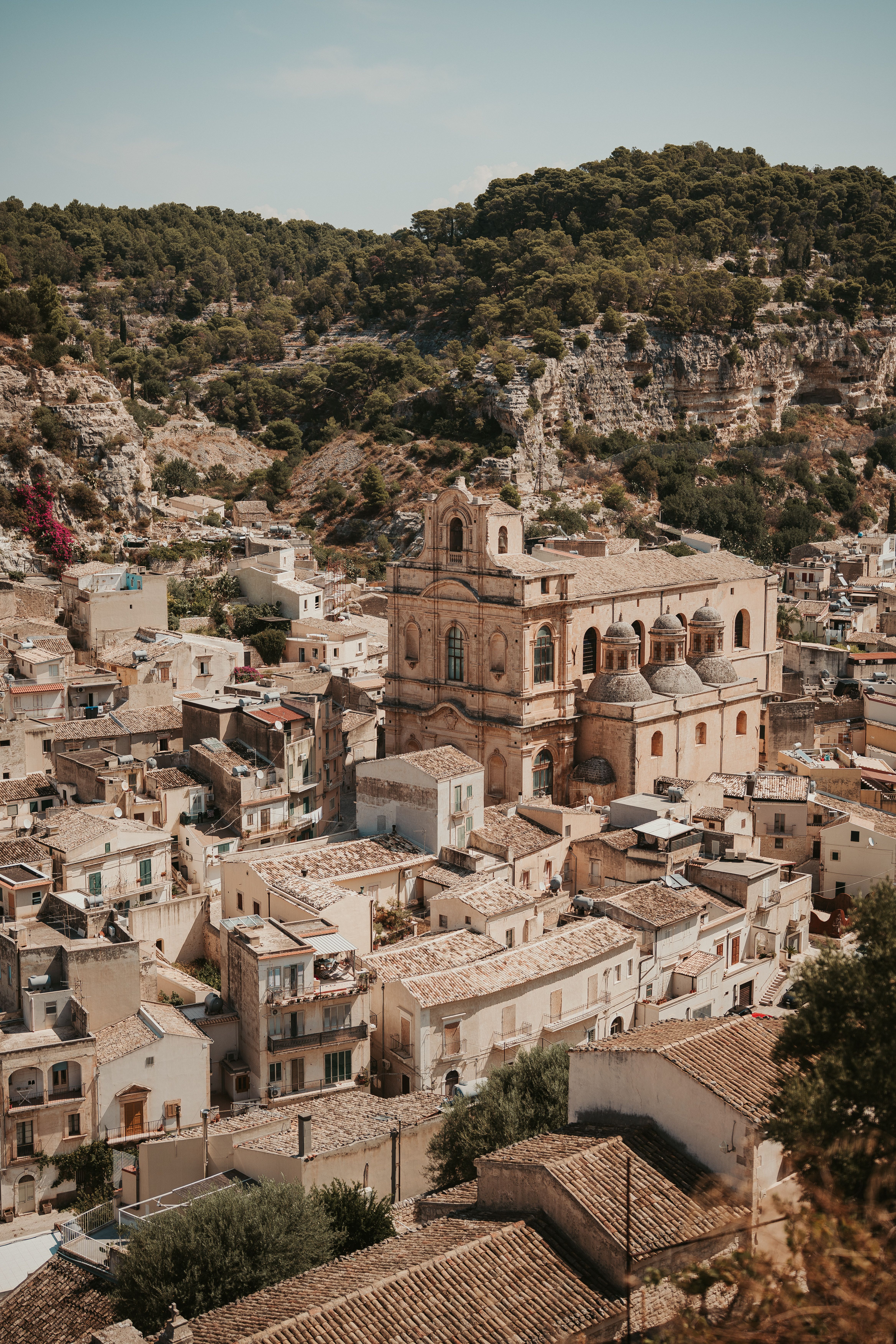 Aerial view of Modica, Sicily showcasing historic architecture and rugged landscape.