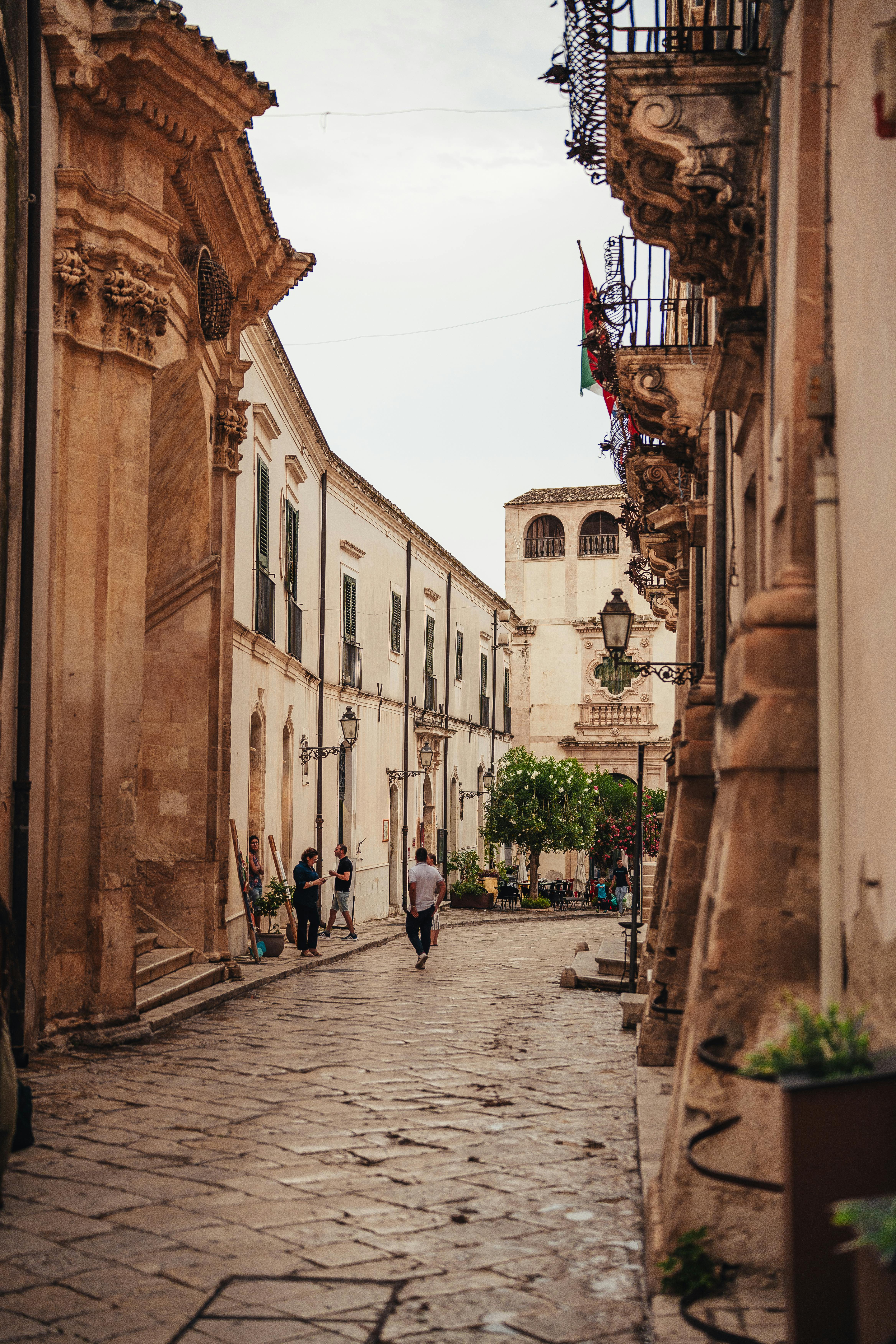 Free Elegant street scene in Scicli, Sicily, showcasing historic architecture and a peaceful ambiance. Stock Photo
