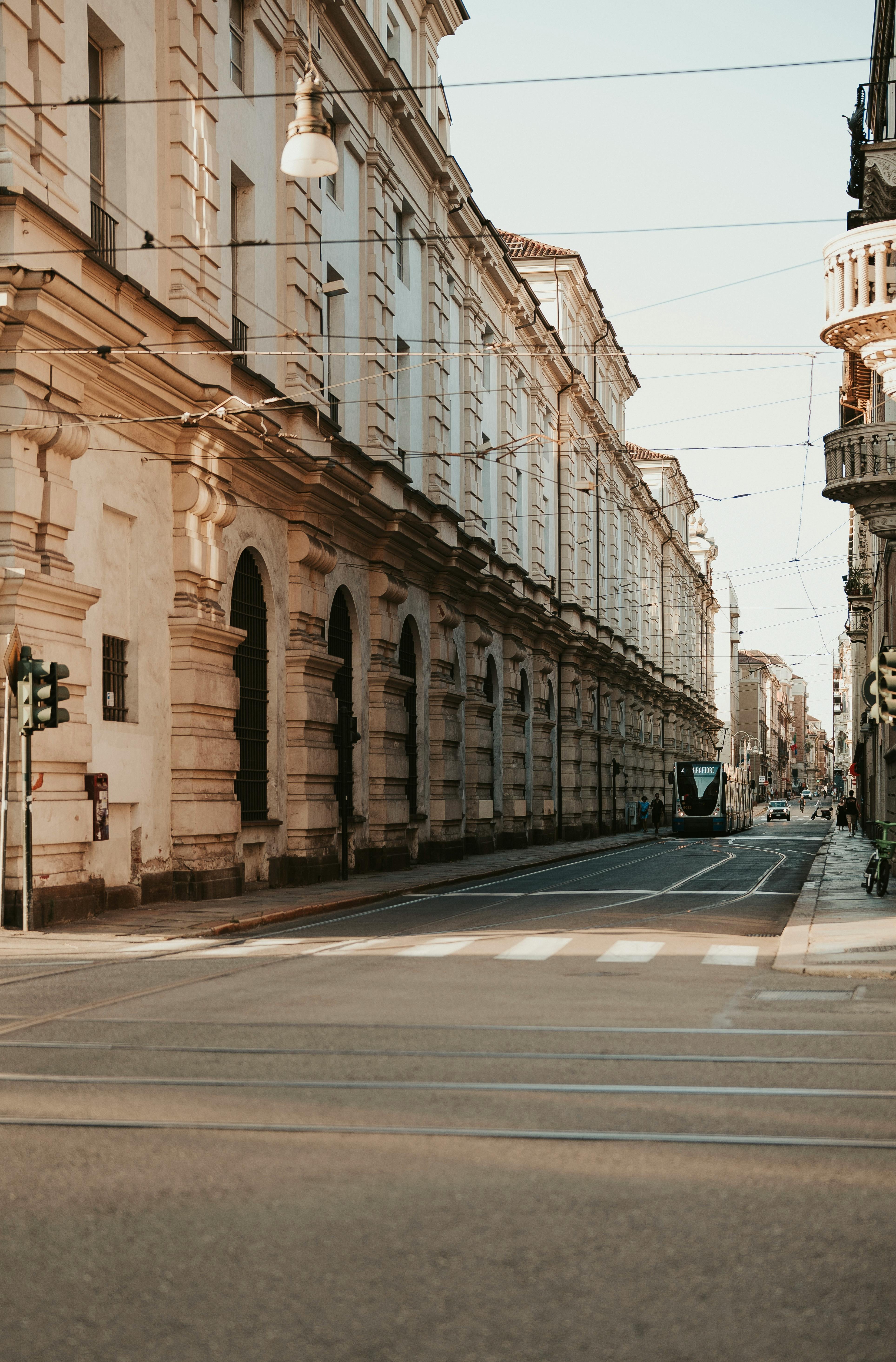 Free Elegant street view in Torino, Italy showcasing beautiful historical architecture and a peaceful urban atmosphere. Stock Photo