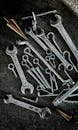 Collection of Metal Tools on Workshop Floor