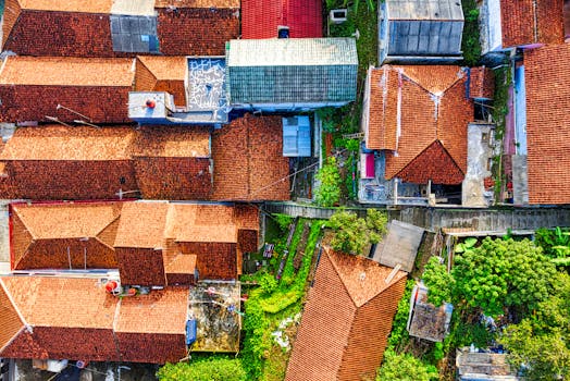 Vibrant aerial shot of traditional rooftops in a West Java village, Indonesia.