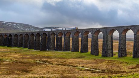 Train crossing a stone viaduct in the Yorkshire Dales — photo by Aaron Mridha on Pexels