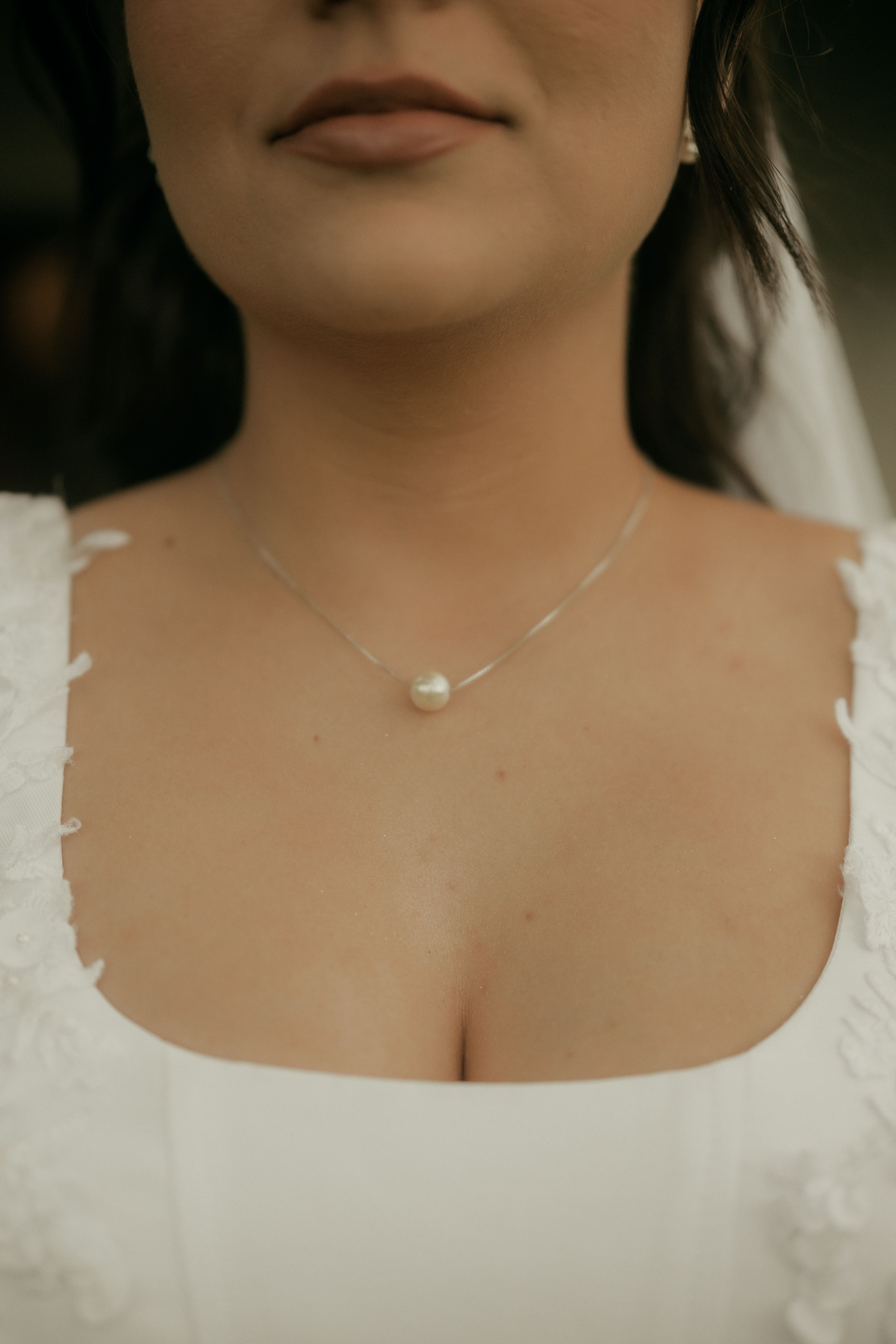 Bride wearing a pearl necklace