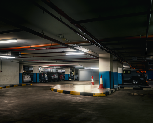 Free Explore the moody atmosphere of this underground parking garage in Kuwait City. Stock Photo