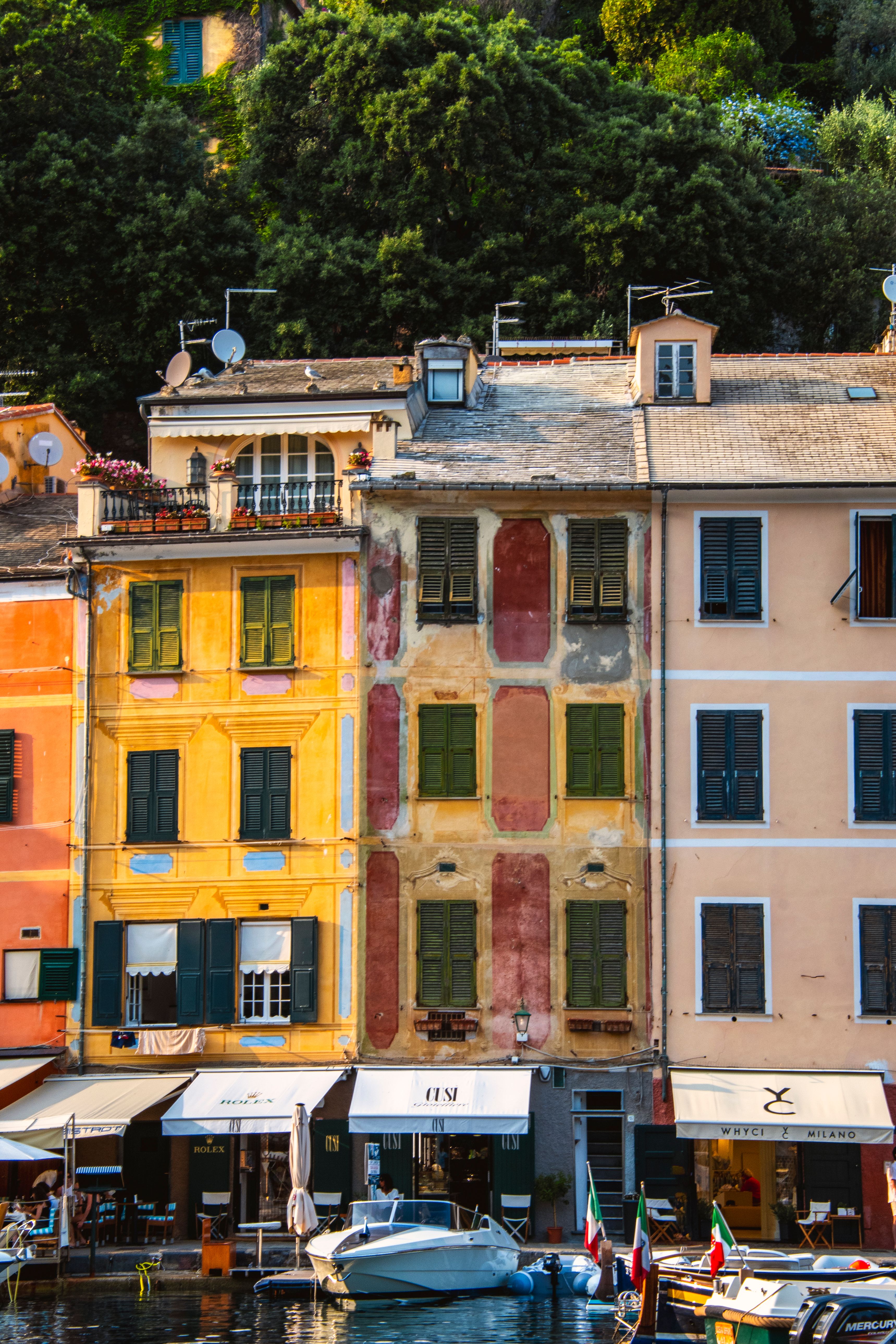 A vibrant view of Portofino's iconic colorful buildings by the harbor in Liguria, Italy.