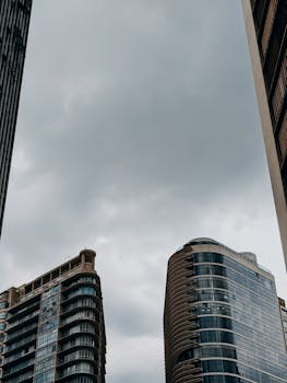 View of modern skyscrapers against a cloudy sky in Belo Horizonte, Brazil, showcasing urban architecture.