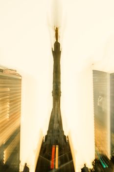 Artistic blur effect of the Angel of Independence monument in Mexico City at dusk.