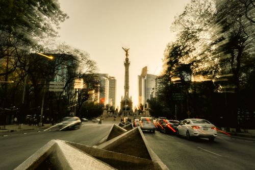 Free Vibrant cityscape of Angel of Independence in Mexico City with motion blur effects at dusk. Stock Photo