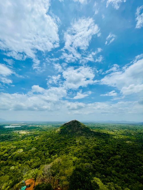 Free Explore the lush greenery and stunning landscapes surrounding Sigiriya Rock in Sri Lanka. Stock Photo