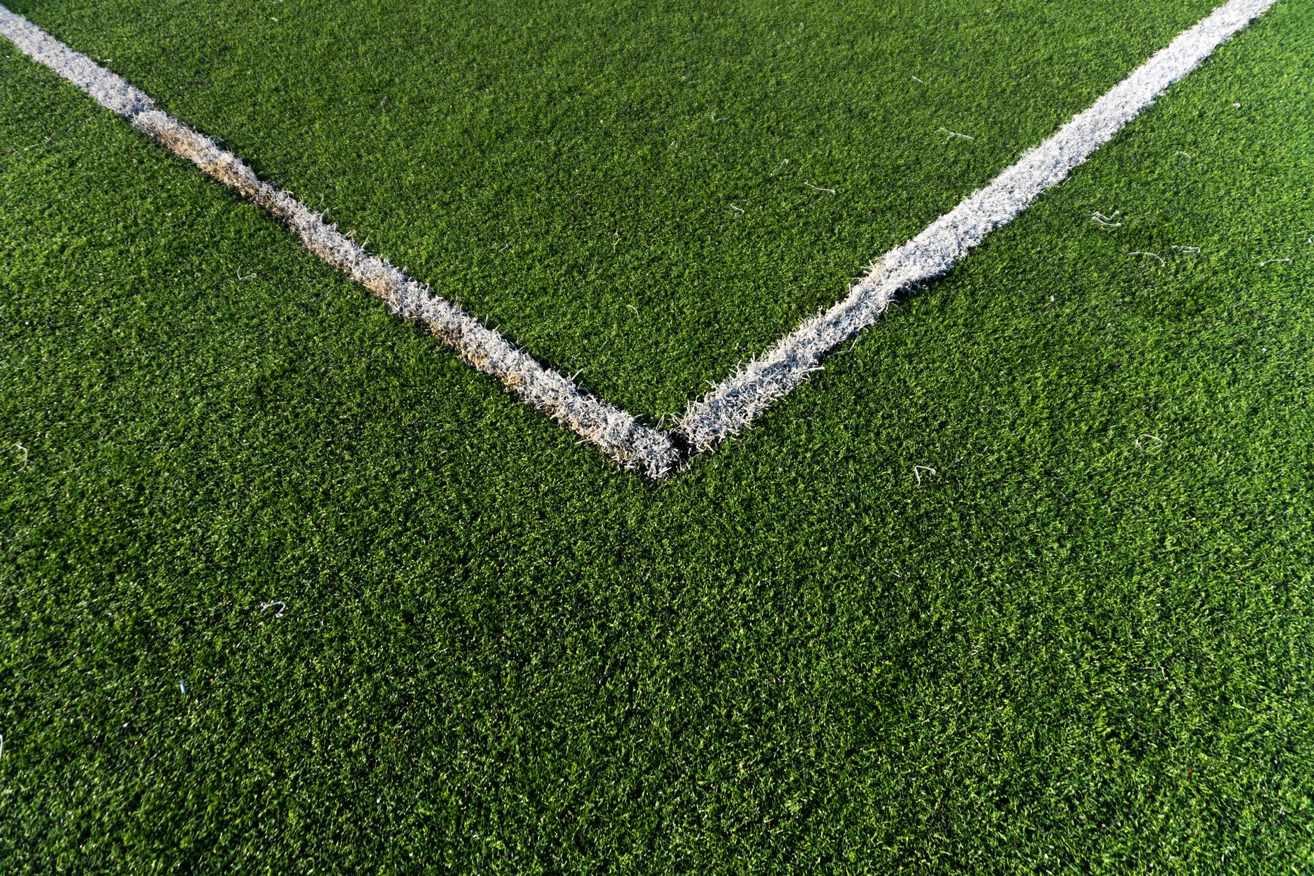 Detailed view of a soccer field corner with vibrant green artificial turf in Istanbul.