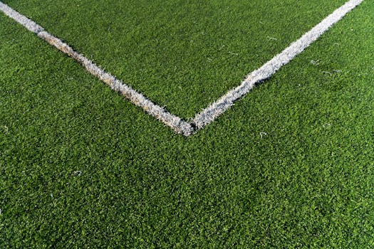 Detailed view of a soccer field corner with vibrant green artificial turf in Istanbul.