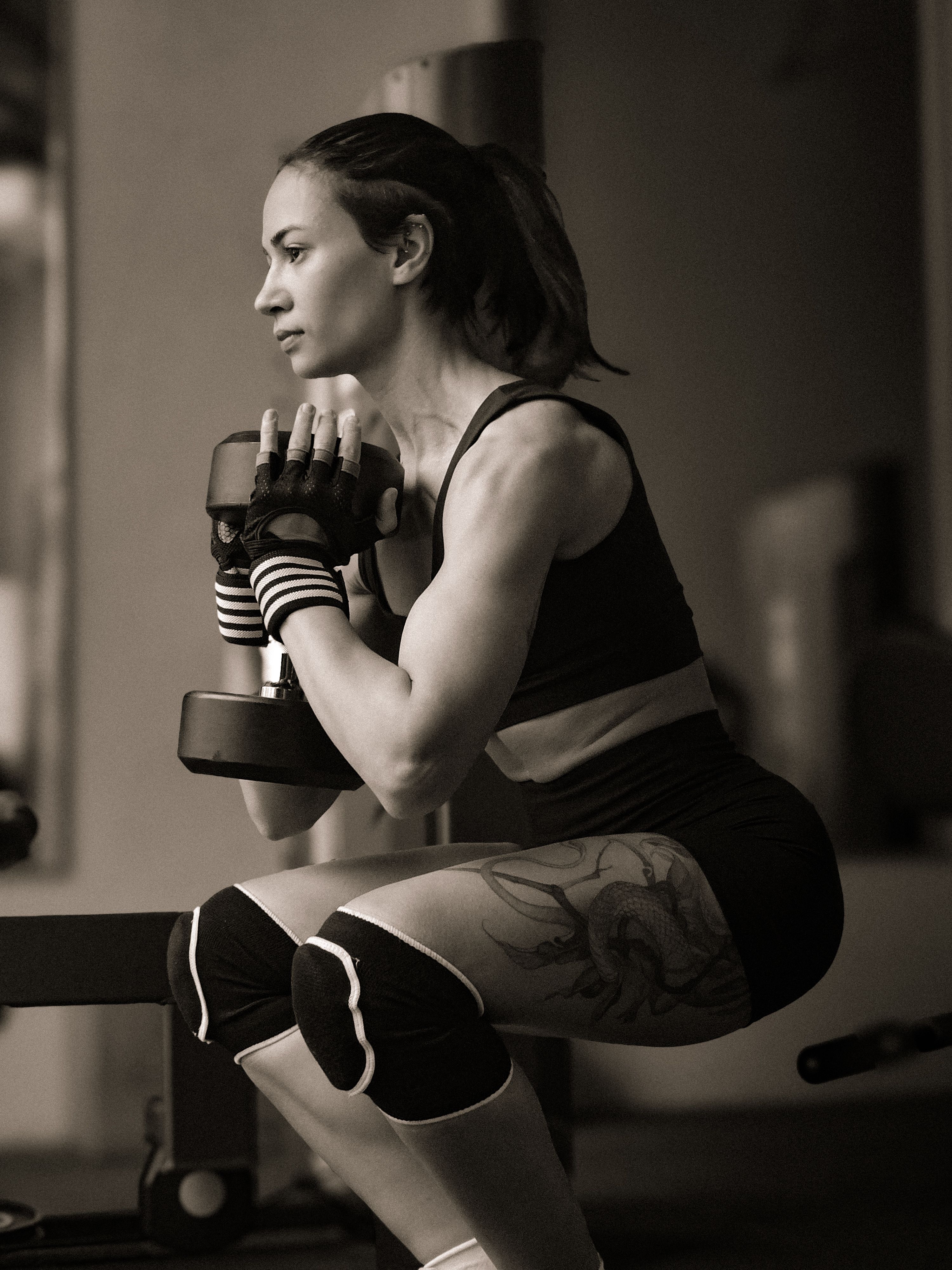 Woman performing strength training with dumbbells