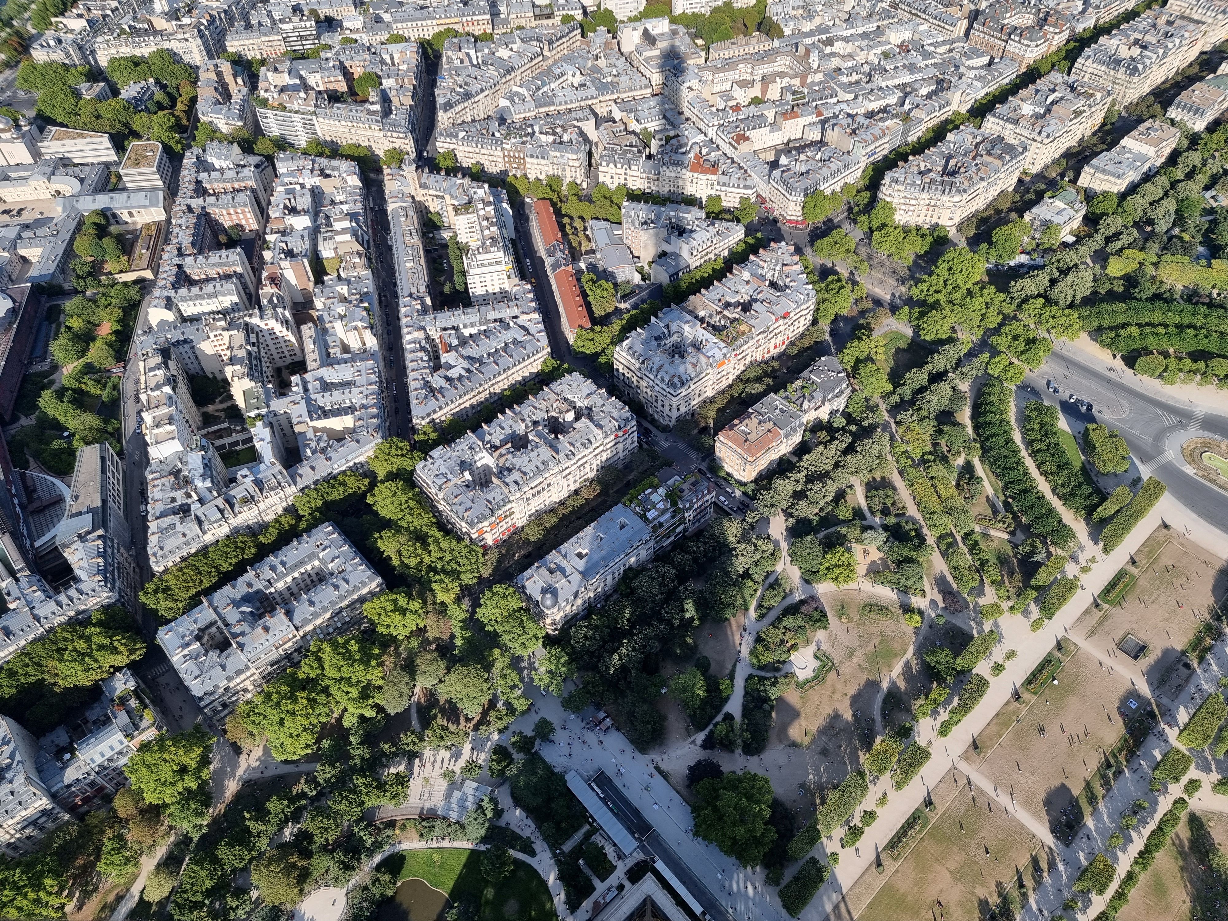 Aerial View of Paris Cityscape with Iconic Shadows · Free Stock Photo