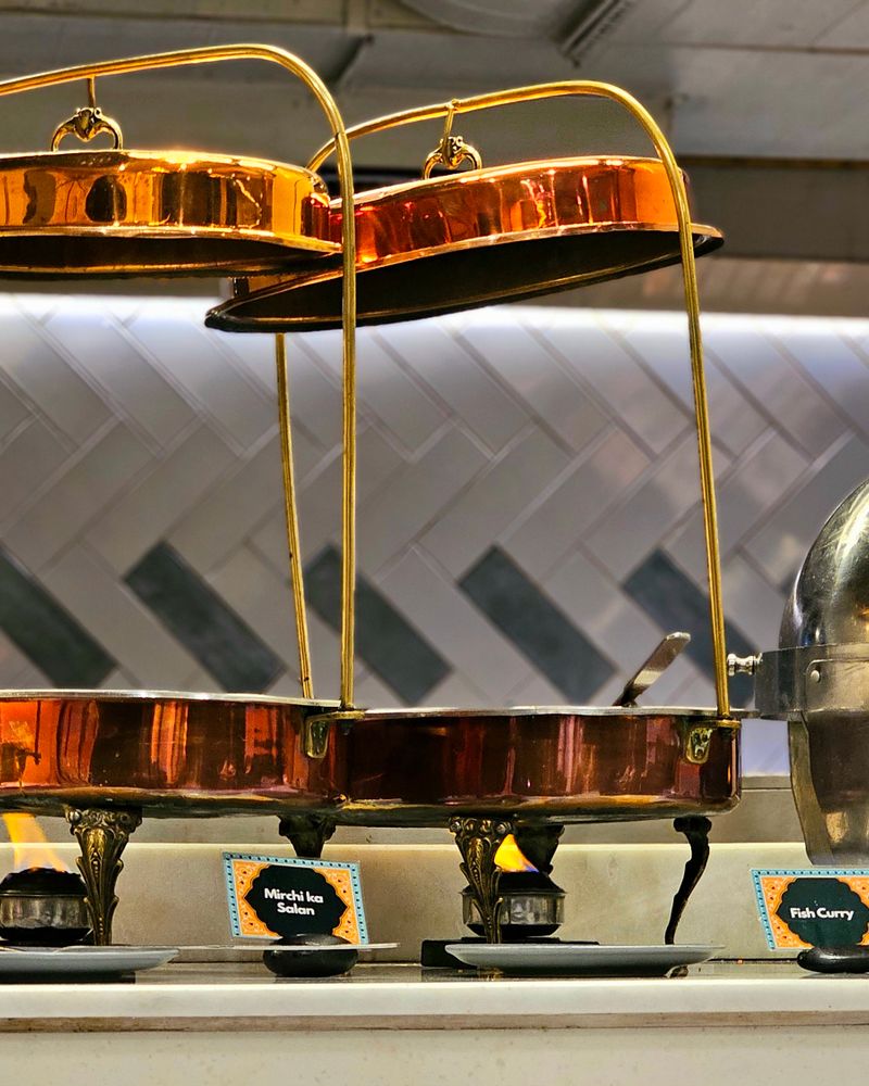 Copper buffet warmers arranged for a dinner service