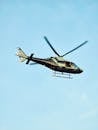 Helicopter in Flight Against Clear Blue Sky