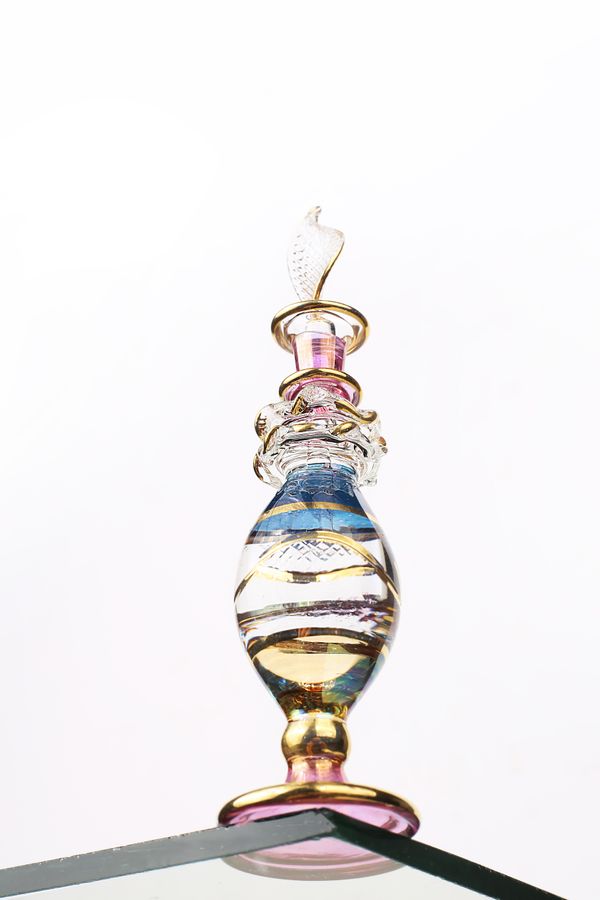 Ornate hand-crafted attar bottle with gold detailing