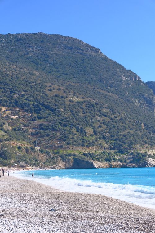 Free Explore the serene beauty of Ölüdeniz Beach with stunning turquoise waters and lush surroundings. Stock Photo