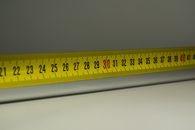 Close-up view of a yellow measuring tape with centimeter marks, emphasizing precision in measurement.