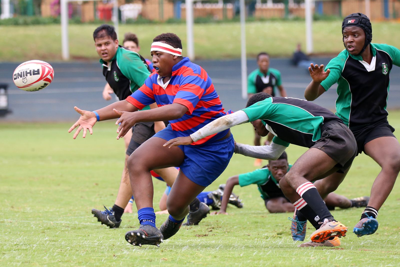 Skarnwick player breaking through two defenders with the ball