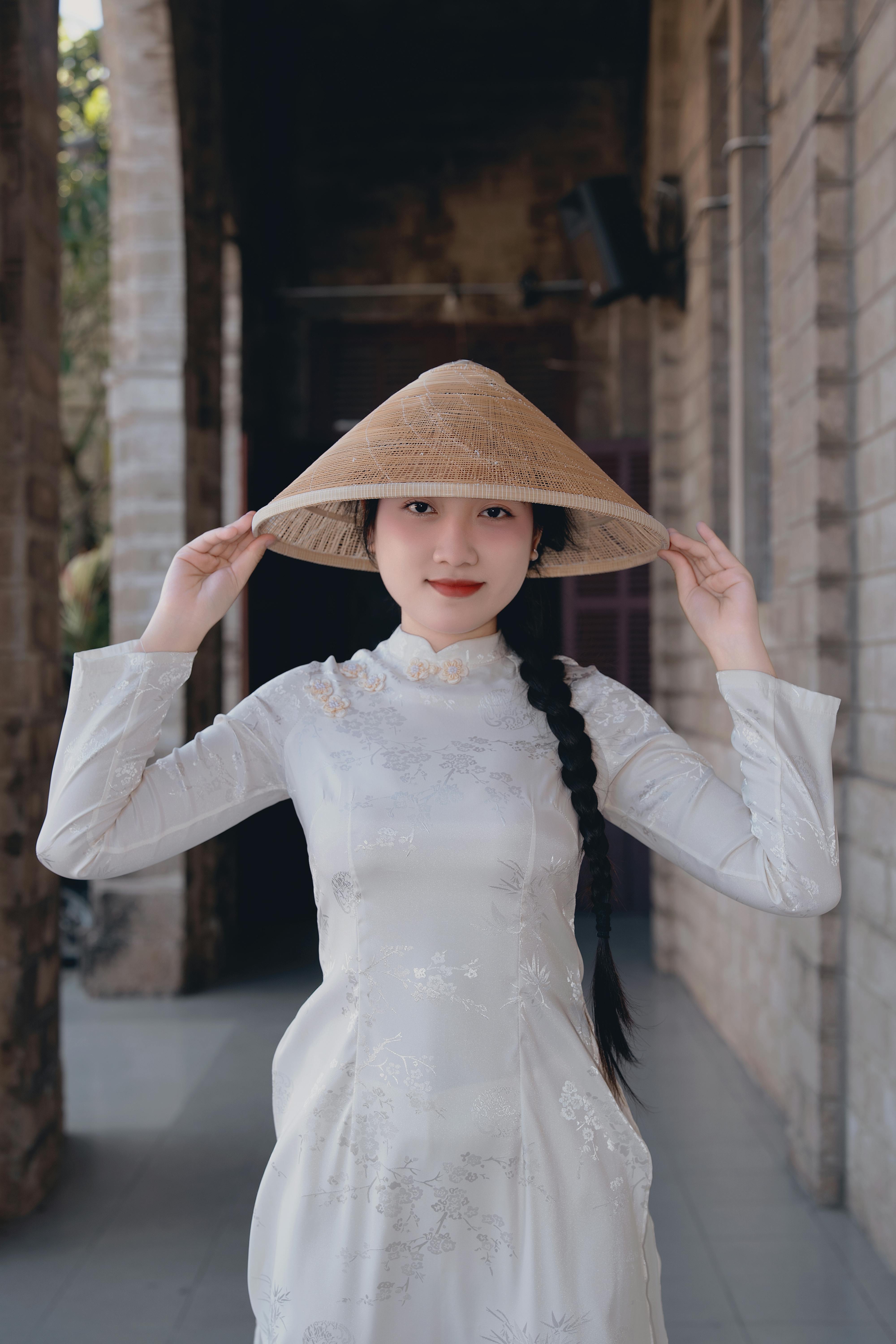 Woman in Traditional Ao Dai with Non La Hat