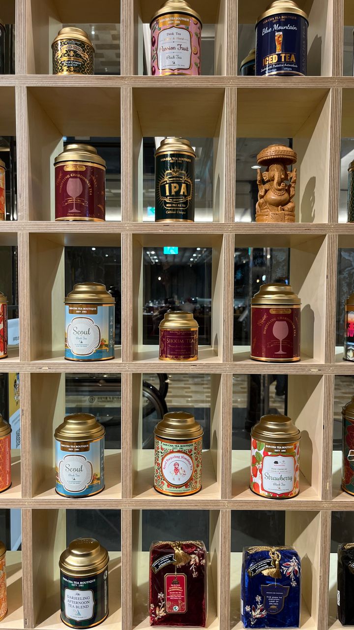 Painted tin can mug rack mounted on a wall for a dollar tree coffee bar design