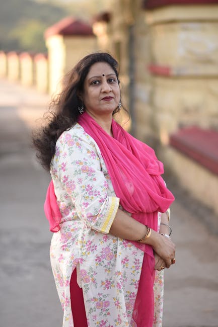 Portrait of an elegant woman in traditional Indian attire posing outdoors in Topchanchi, India.