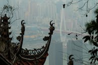 Traditional Roof Overlooking Modern Cityscape