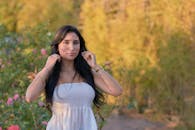 Young Woman in Garden Setting at Sunset