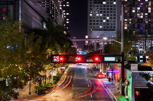 Free Vibrant night scene of South Miami Avenue with light trails and illuminated buildings. Stock Photo