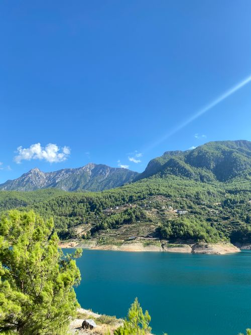 Free Breathtaking view of the Taurus Mountains with clear blue lake under a vibrant sky. Stock Photo