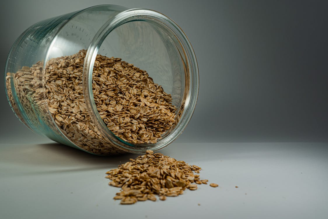 Free Brown Oats In Clear Glass Jar Stock Photo