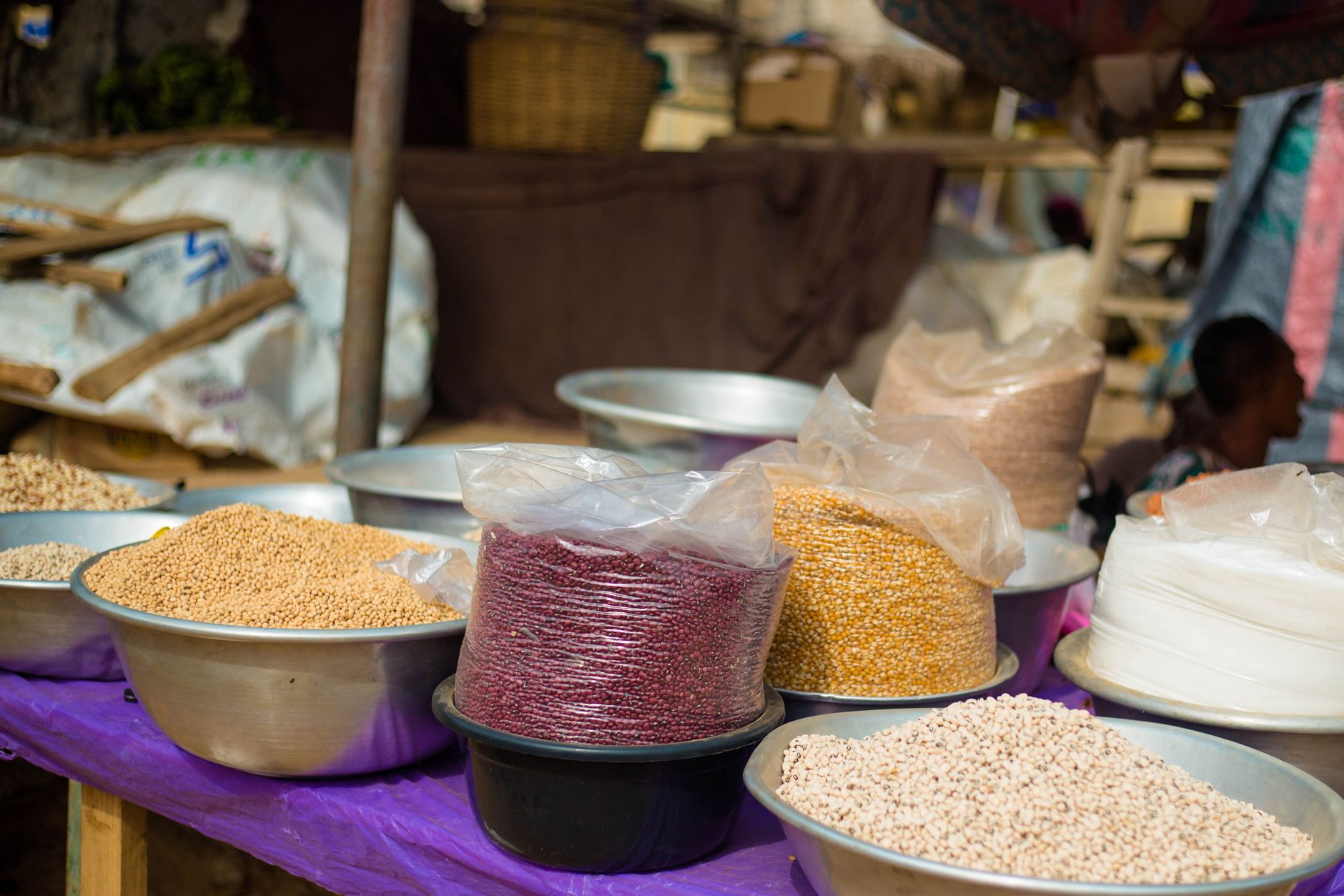 Colorful display of different grains in a market in Accra, Ghana, showcasing local food diversity.