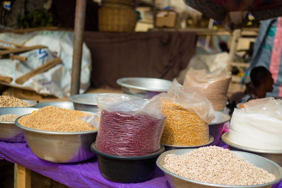 Colorful display of different grains in a market in Accra, Ghana, showcasing local food diversity.