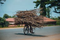 Bicycle Loaded with Firewood on a Rural Road