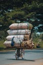 Bicycle Transporting Heavy Load on Rural Road