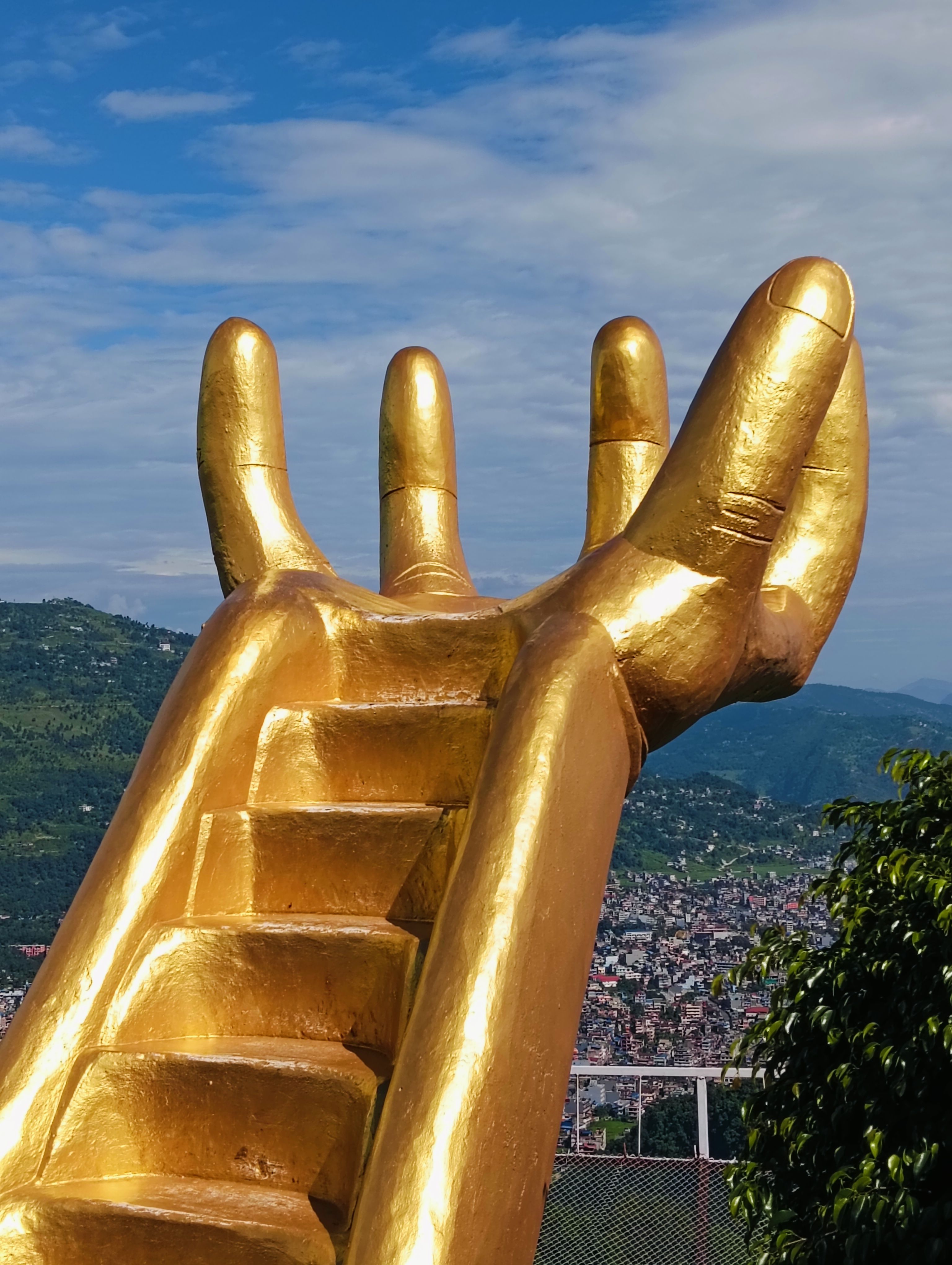 Giant Golden Hand Sculpture with Steps in Scenic View · Free Stock Photo