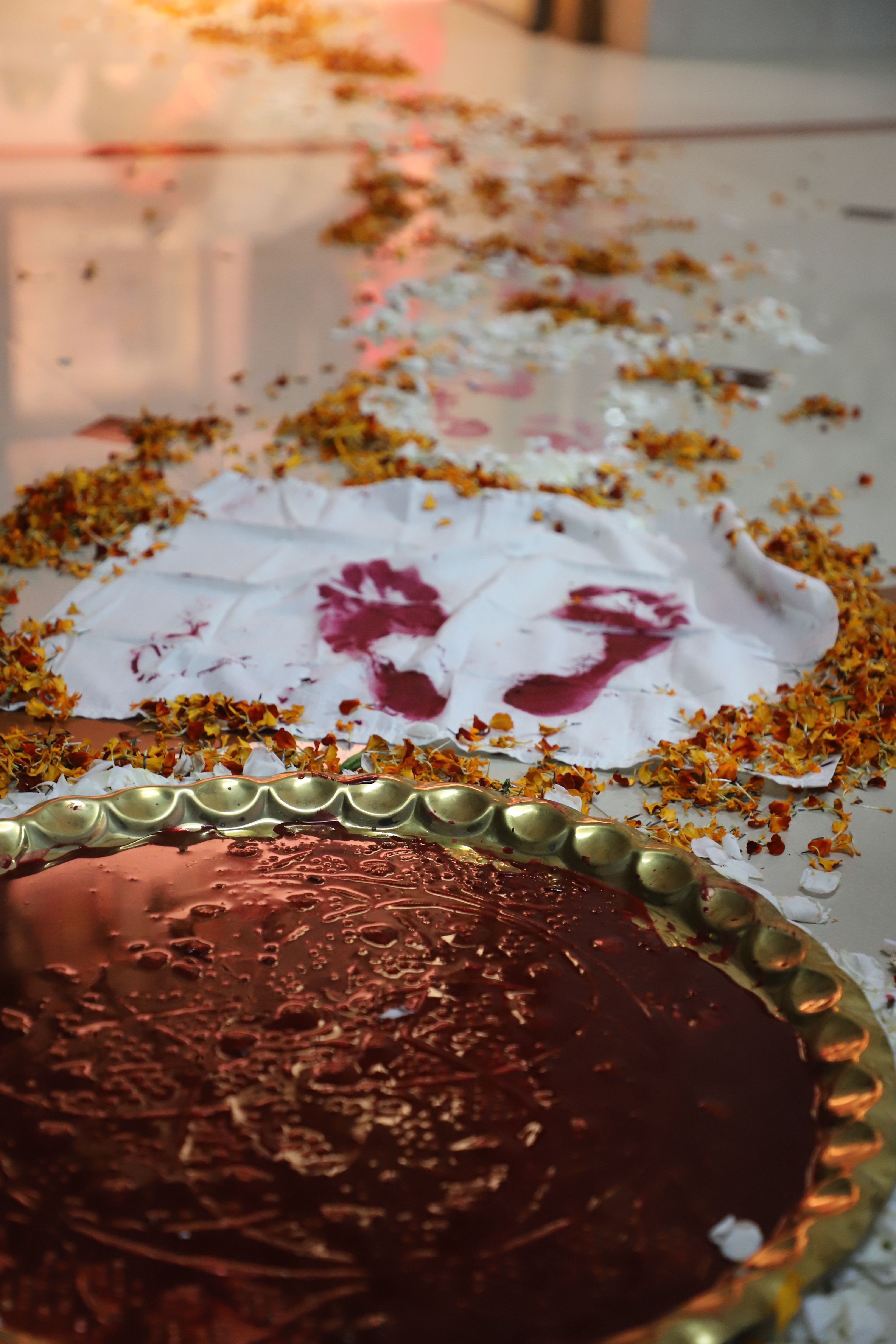 Ceremonial footprints with flower petals in Indian wedding ritual. Dhari, Gujarat.