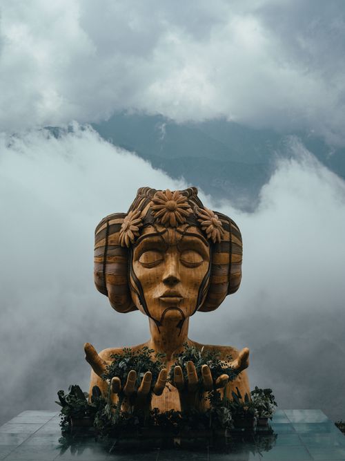 Free Stunning wooden sculpture in the misty mountains of Lào Cai, Vietnam. Stock Photo