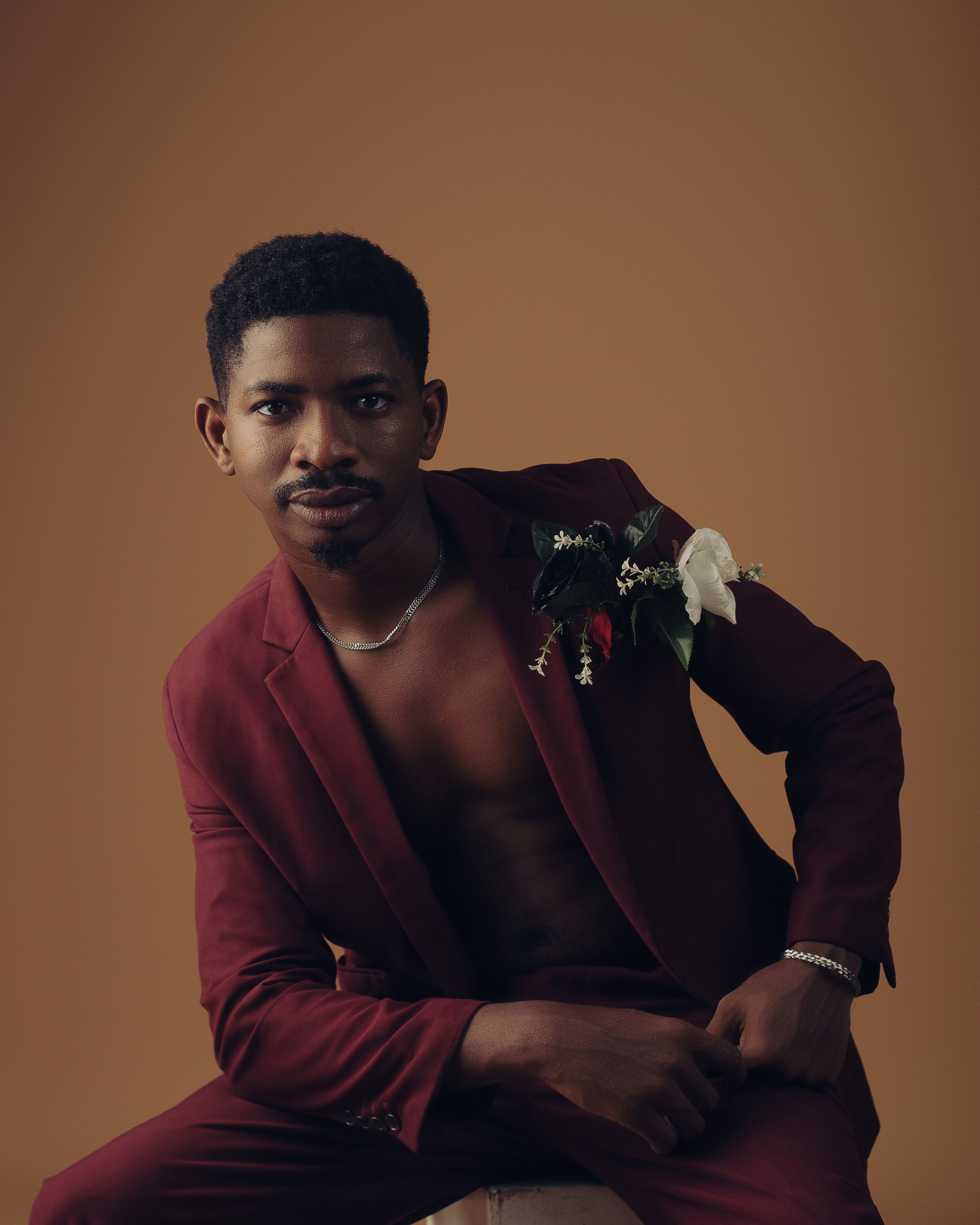 Elegant Portrait of a Man in a Suit with Floral Accent · Free Stock Photo