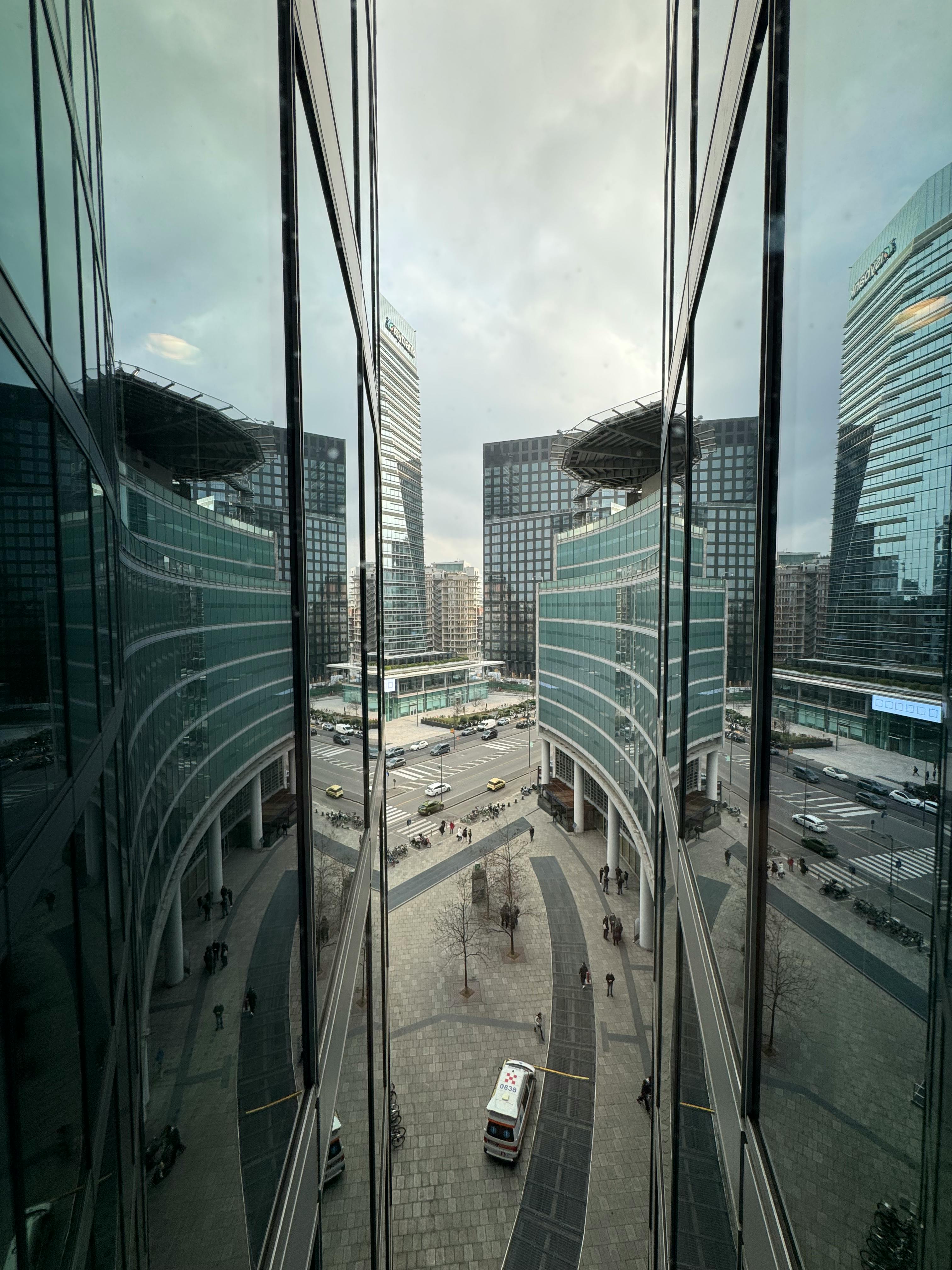 Free A stunning reflection of Milan's modern skyscrapers showcasing urban architecture from a high angle. Stock Photo