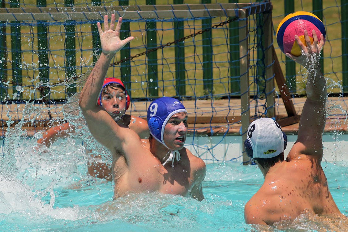 Men Playing with a Ball  in Swimming Pool