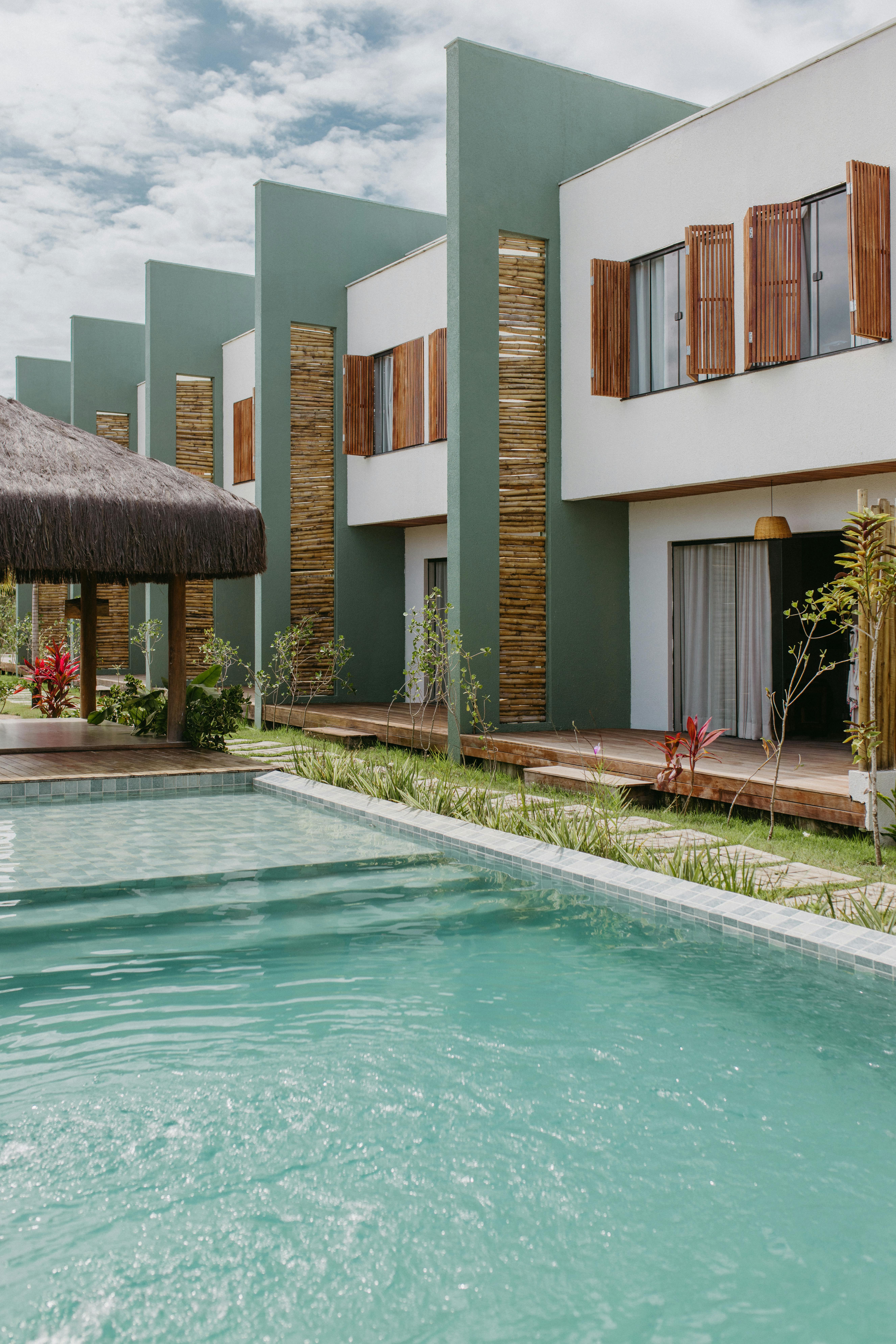 Free Stunning modern villa with a pool and garden in Bahia, Brazil under a clear sky. Stock Photo