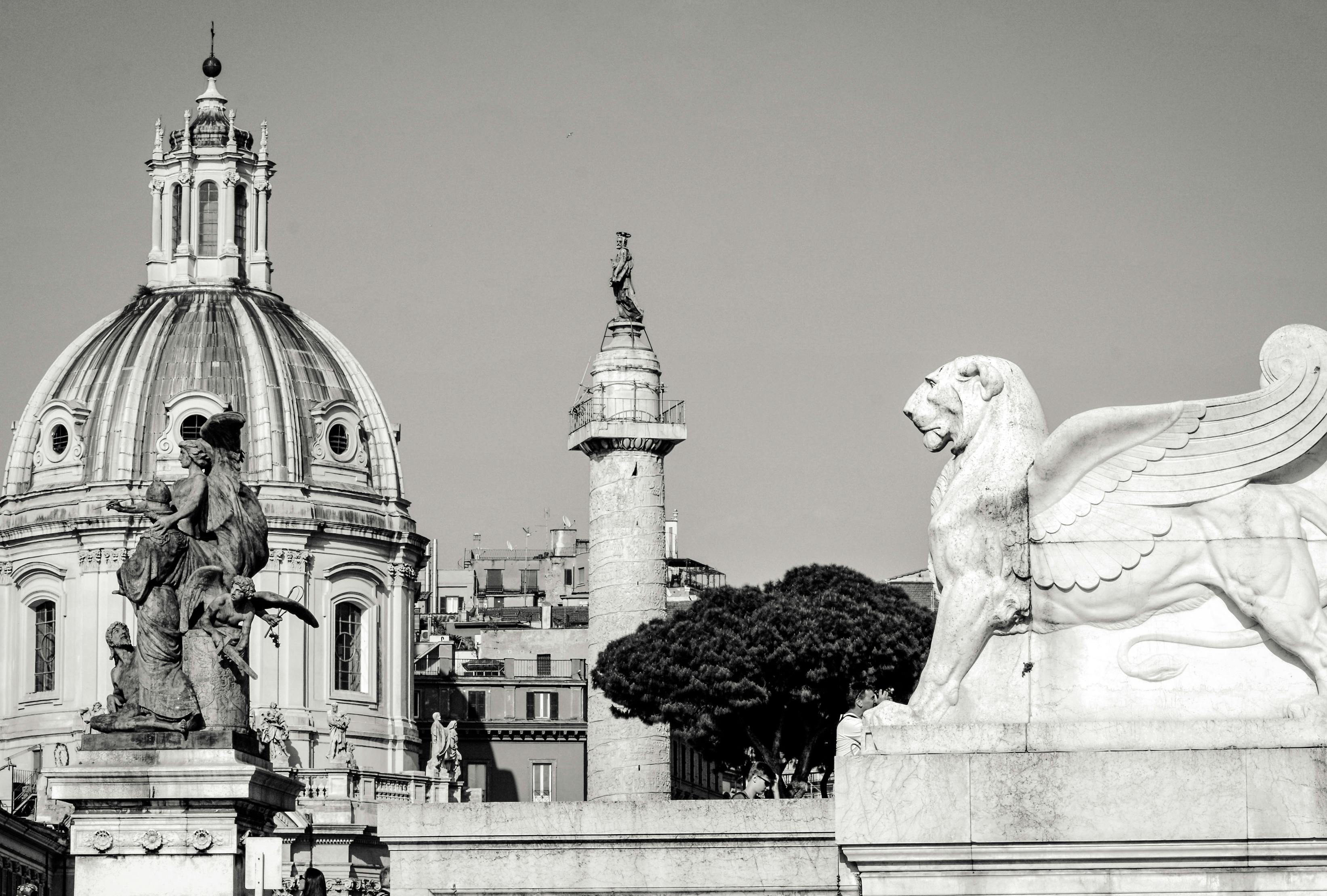 Free Black and white image of iconic Roman landmarks with statues and architecture. Stock Photo