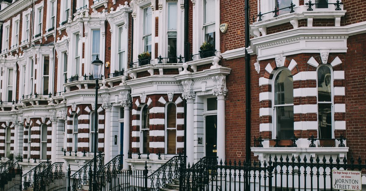 Row of classic Victorian townhouses in Hortons Street, London, showcasing architectural elegance.
