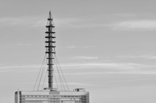 Free Black and white capture of a modern TV tower against a clear sky, minimalist style. Stock Photo