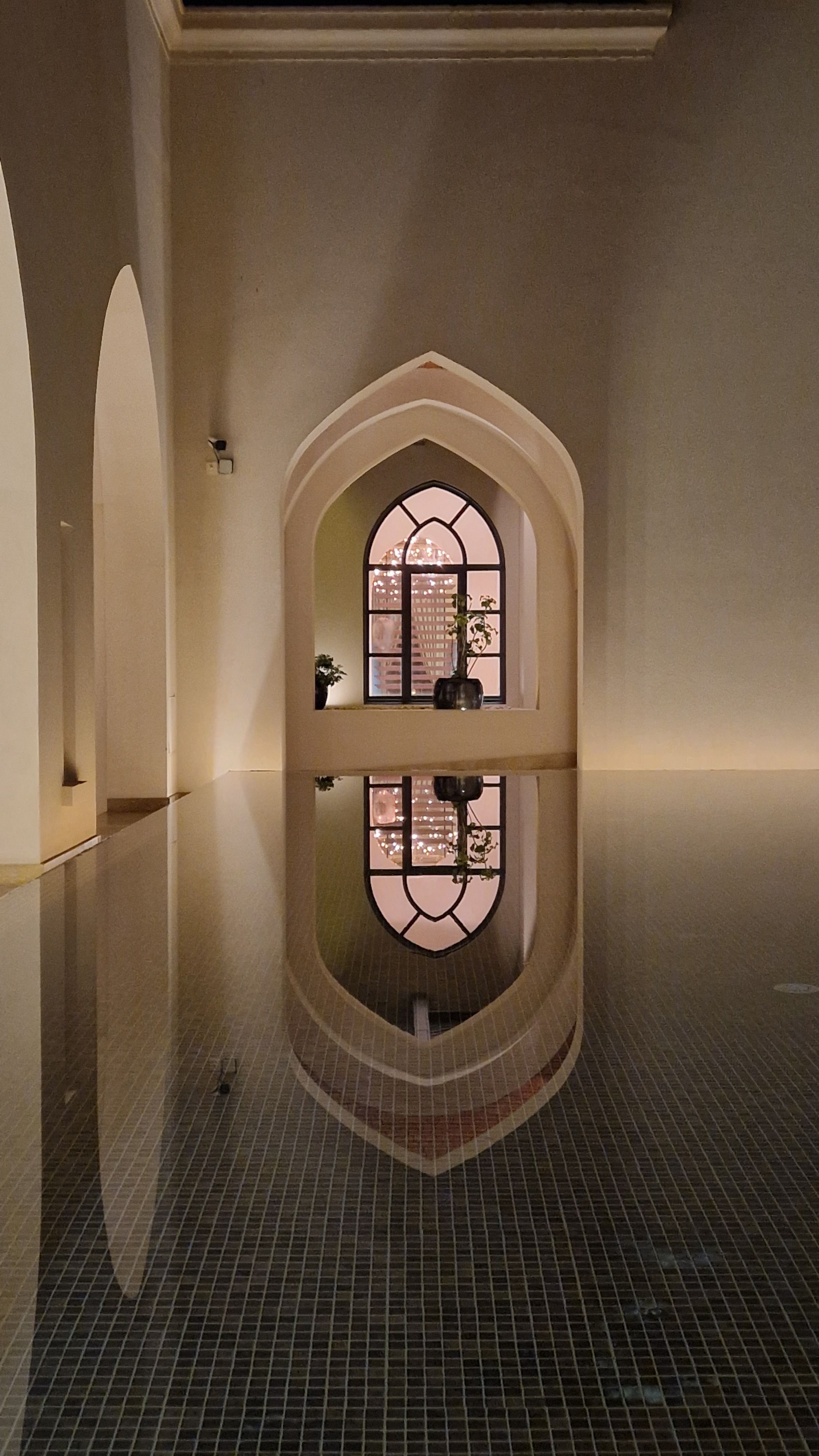 Serene Arched Interior Reflection at Twilight · Free Stock Photo