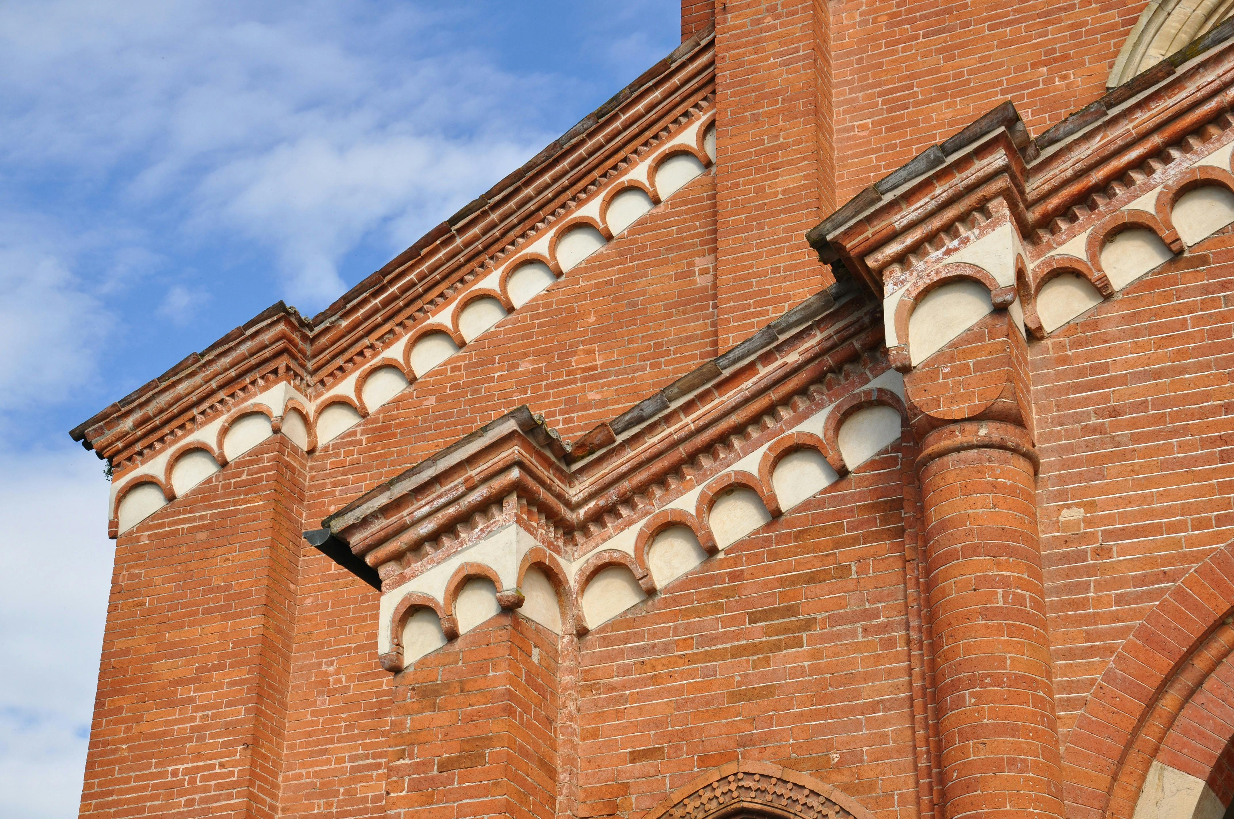Free Close-up of brick architecture at Chiaravalle Abbey, showcasing intricate Romanesque designs. Stock Photo